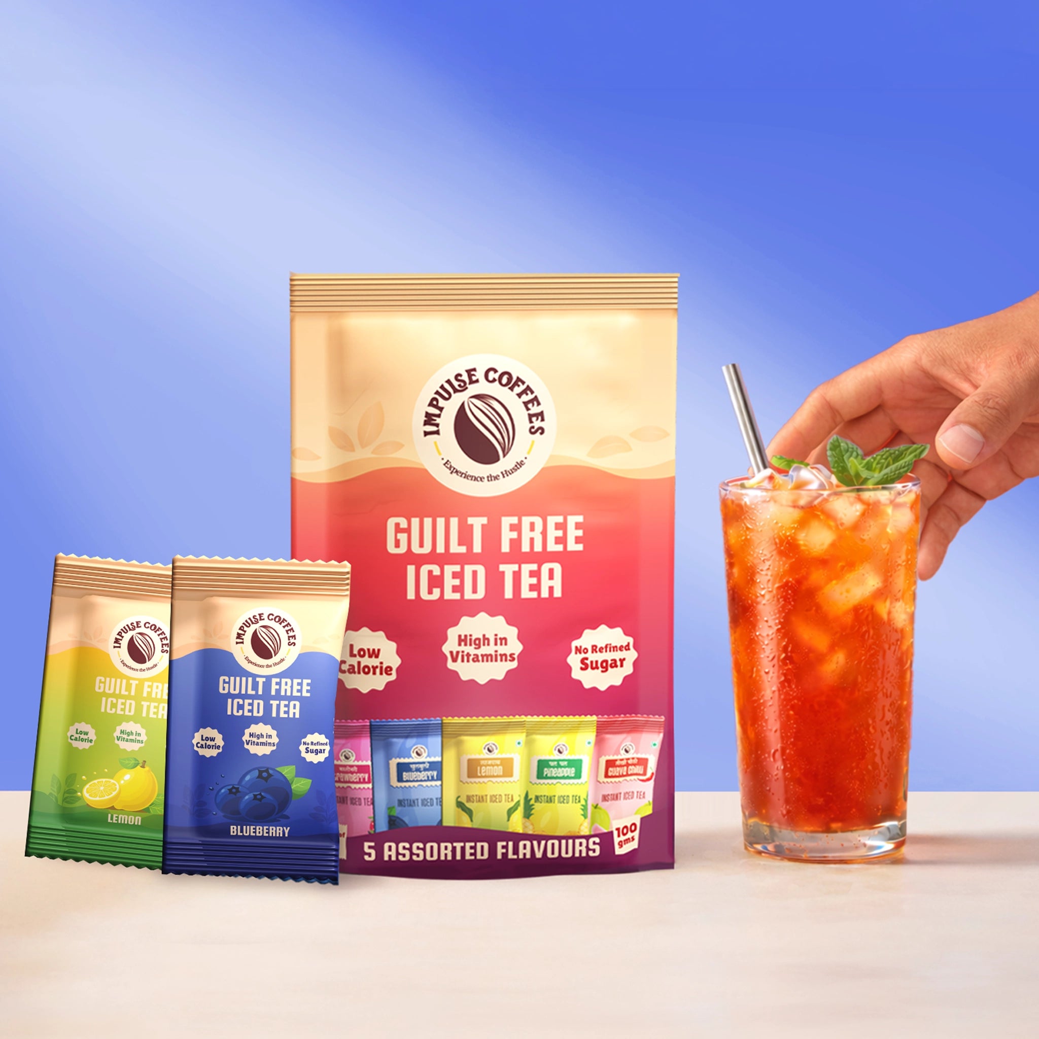 Impulse Coffees Guilt-Free Instant Iced Tea pack featuring 5 assorted flavors next to a refreshing glass of iced tea with ice and mint.