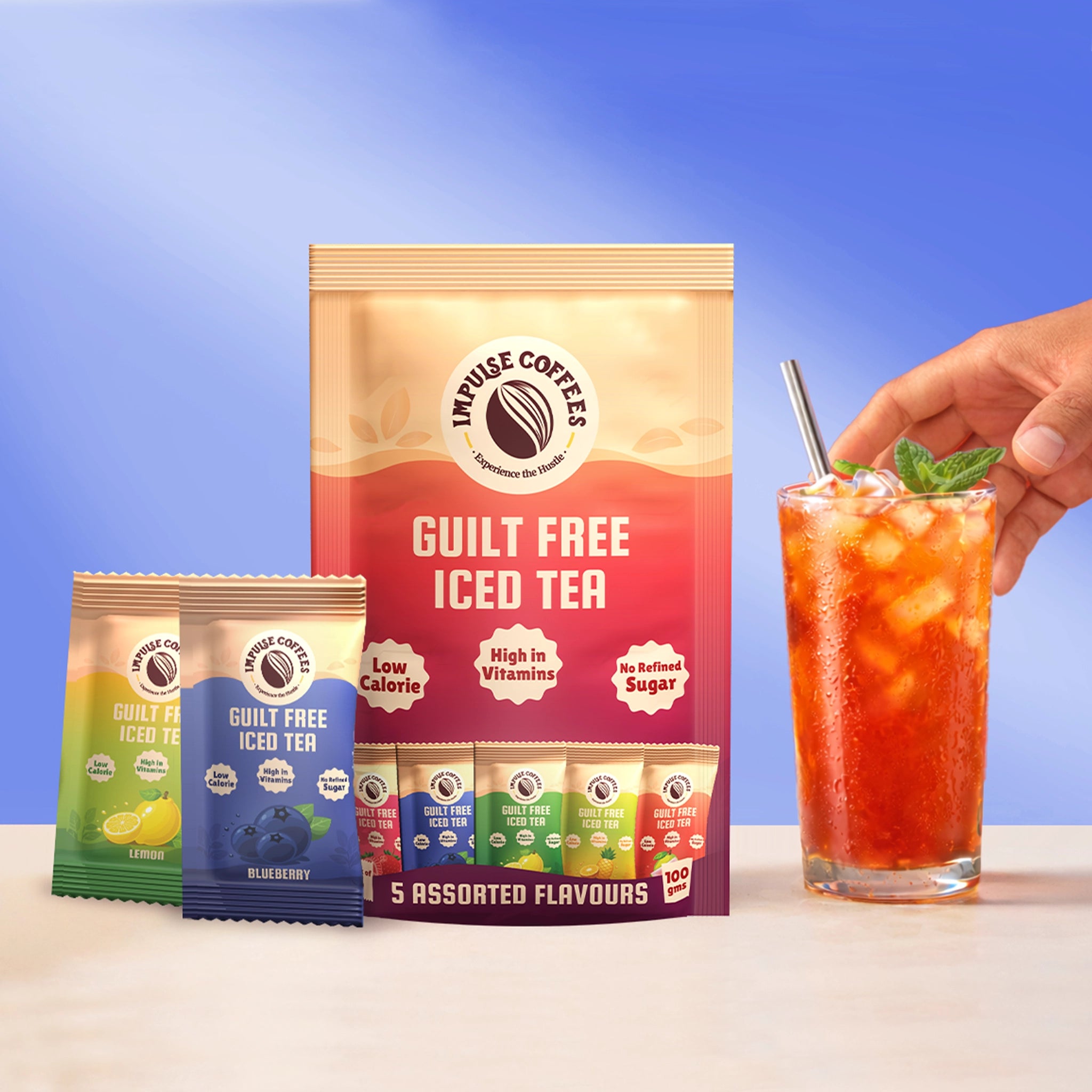 Impulse Coffees Guilt-Free Instant Iced Tea pack featuring 5 assorted flavors next to a refreshing glass of iced tea with ice and mint.