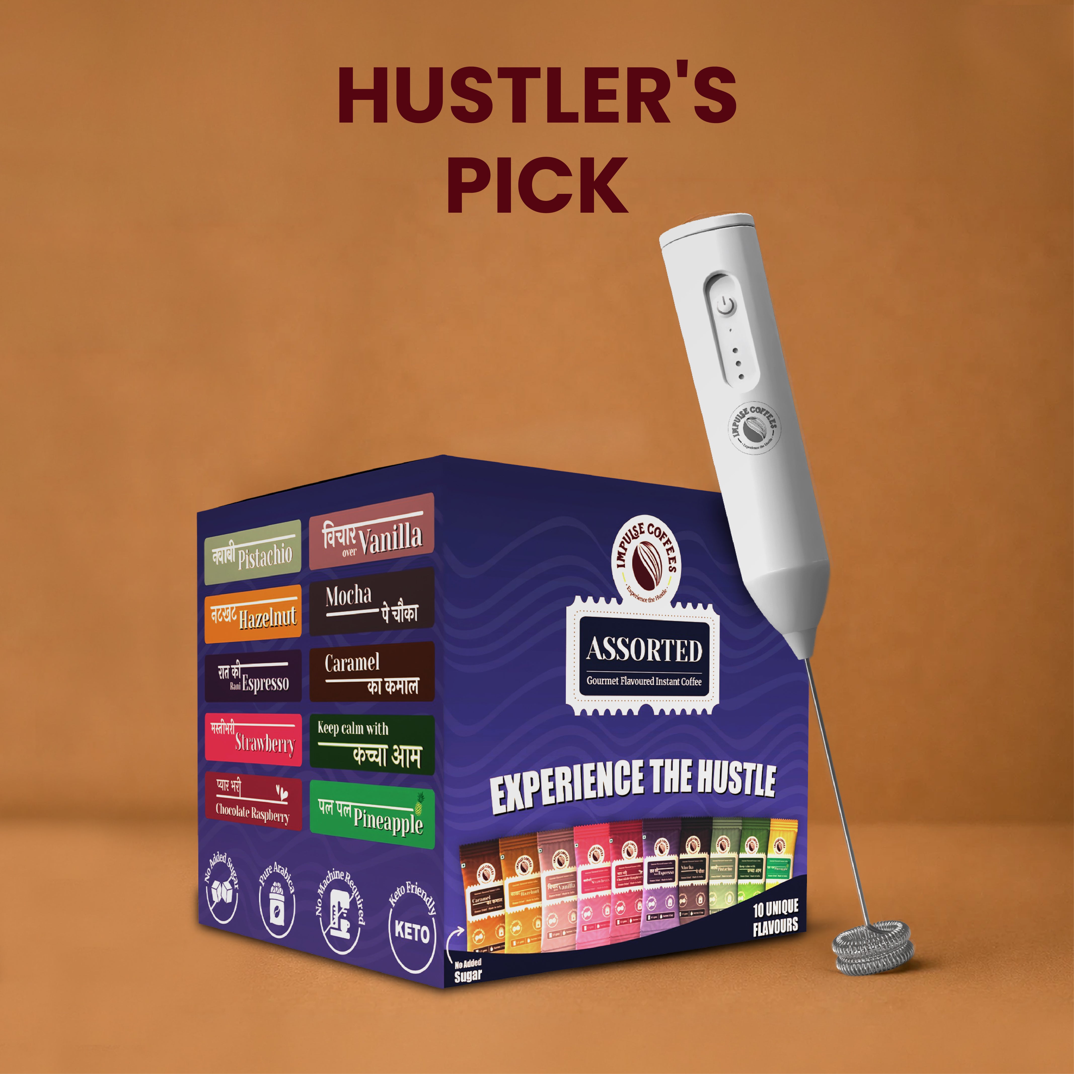 Impulse Coffees Hustler's Pick travel bundle showcasing a deep blue box of Assorted Gourmet Flavoured Instant Coffee with 10 unique sachet flavours next to a standing white electronic rechargeable milk frother against a warm brown studio background.