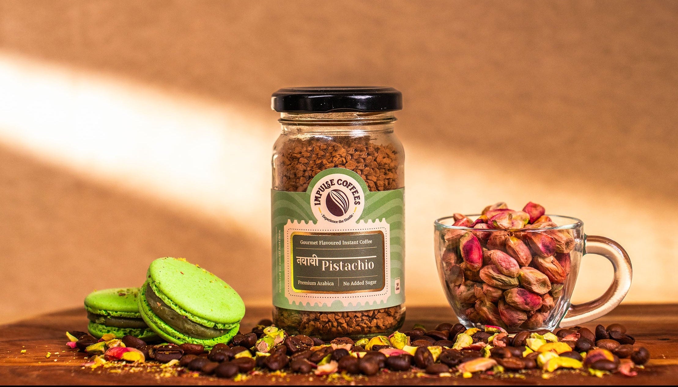 Jar-of-pistachio-coffee-with-green-cookies-and-a-glass-of-pistachios-on-a-wooden-surface