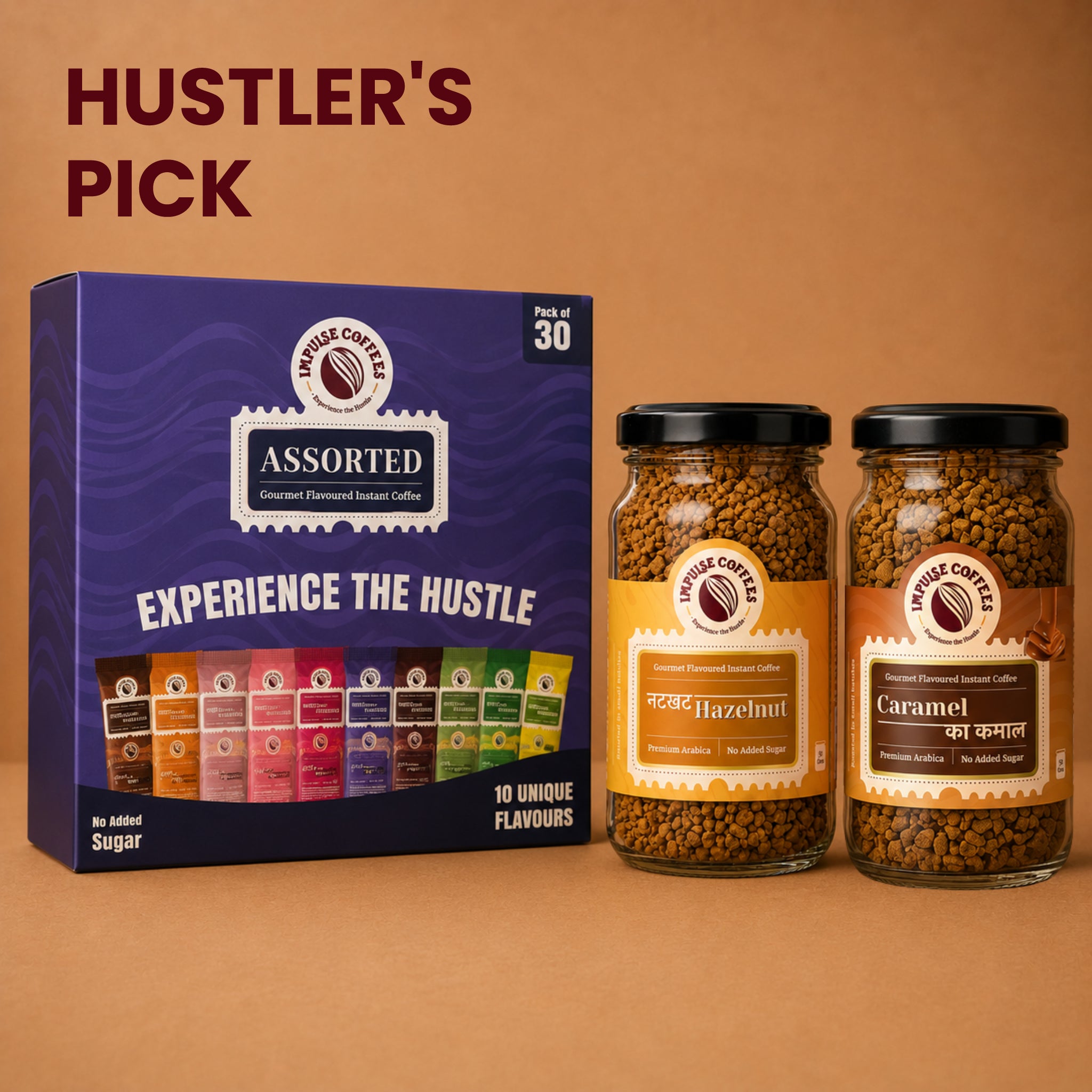 Impulse Coffees Hustler's Pick coffee bundle featuring an Assorted Gourmet Flavoured Instant Coffee box of 30 sachets standing next to two premium glass jars of Nutkhat Hazelnut and Caramel Ka Kamal flavours.