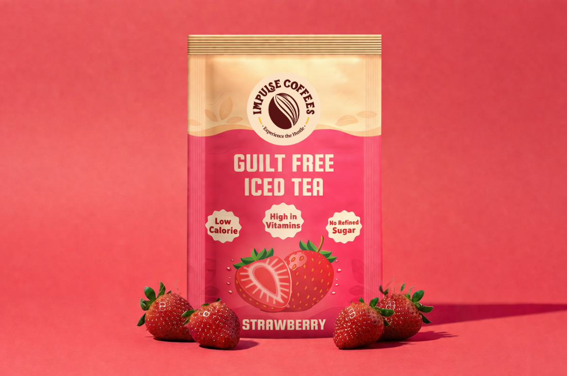 Impulse Coffees Guilt Free Strawberry Iced Tea pouch featuring fresh whole and halved strawberries on a vibrant pink studio background.