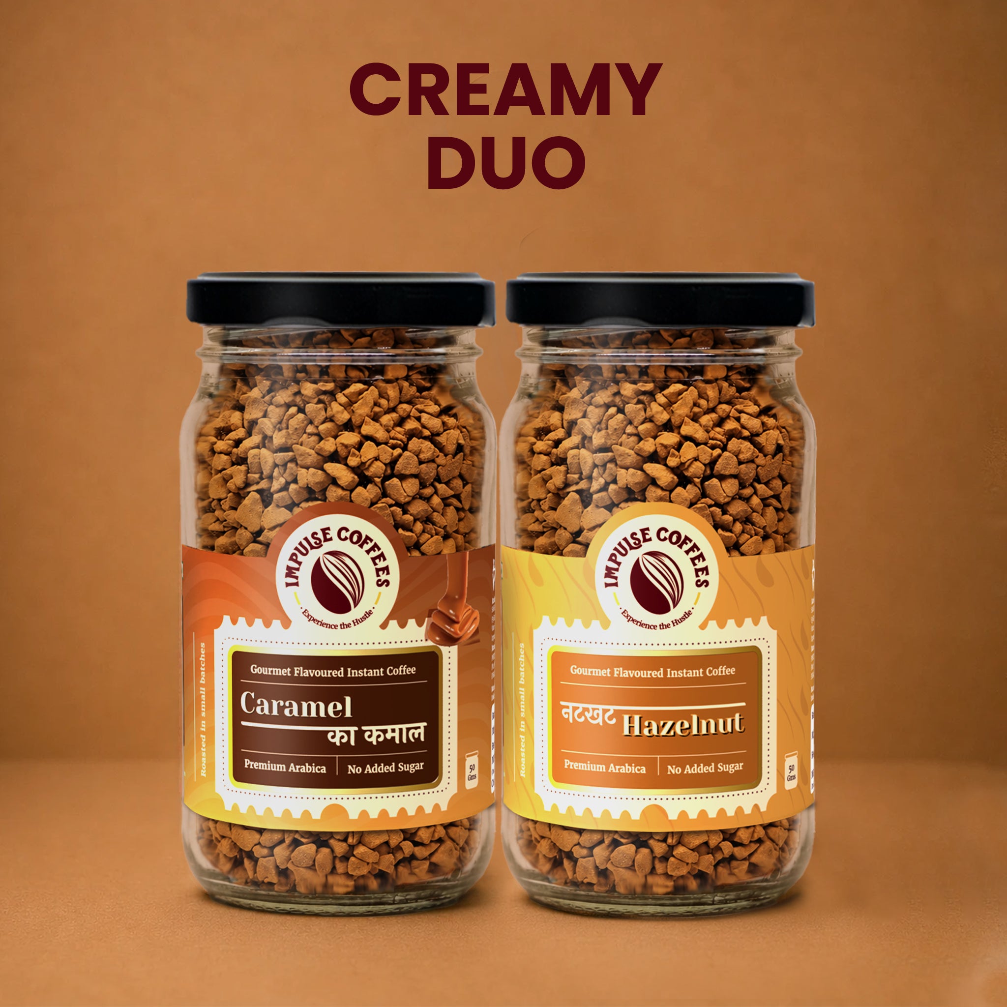 Impulse Coffees Nutty Coffee Delight product bundle featuring two glass jars standing side-by-side on a warm brown background: Caramel Ka Kamal and Nutkhat Hazelnut gourmet flavoured instant coffee.