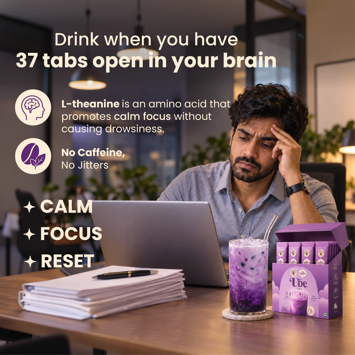 Man working on laptop with iced Ube Latte for calm focus and L-theanine benefits